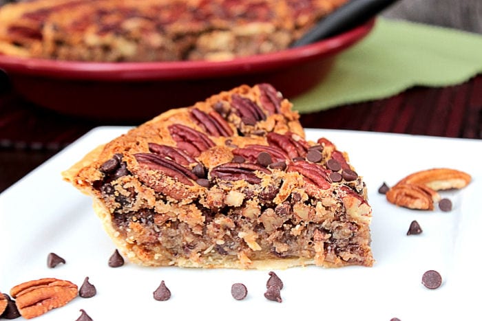 Chocolate Chip Pecan Pie on a white plate.