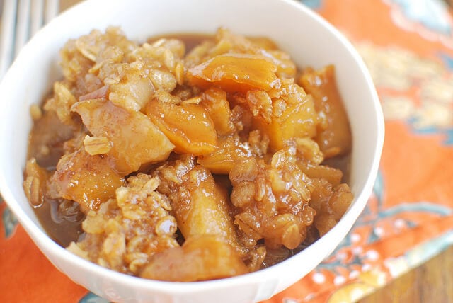 Slow Cooker Caramel Apple Crumble {Fake Ginger} in a white bowl.