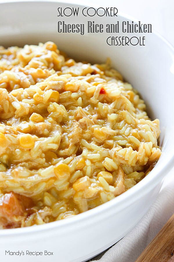 Slow Cooker Cheesy Rice and Chicken Casserole in a white casserole dish.