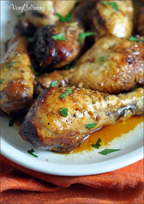 Slow Cooker Honey-Soy Chicken Drumsticks on a white plate.
