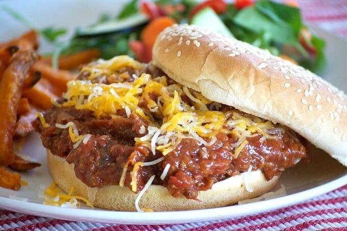 Slow Cooker Sloppy Joe on a plate with a salad.