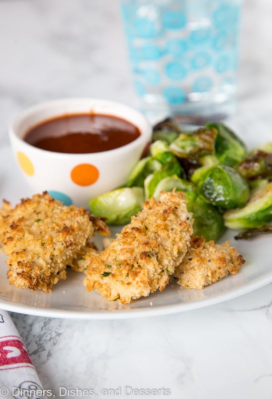 Homemade Chicken Nuggets - make a grown up version of a childhood favorite at home with these homemade chicken nuggets. Baked, perfectly crispy, and ready in minutes!