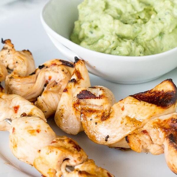 Chicken Skewers - tender pieces of chicken marinated with lots of lime juice and chipotle, then grilled and served with an avocado dipping sauce.