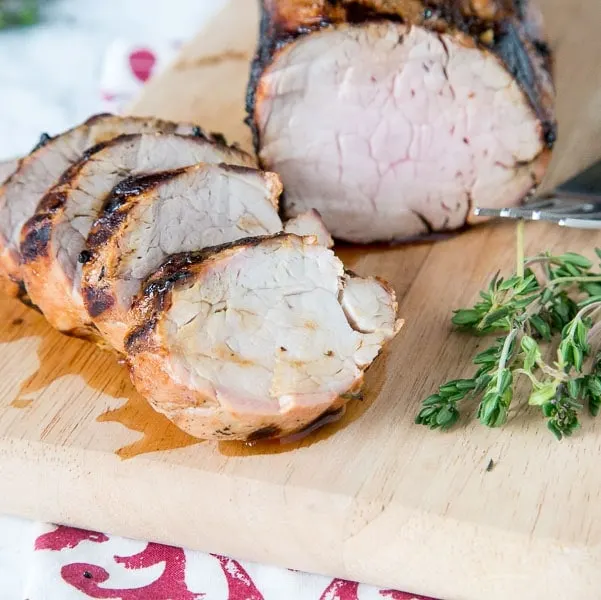 Herb Grilled Pork Tenderloin - a flavorful marinade with lemon juice and fresh herbs makes this pork tenderloin super moist and tender. Great on chicken and fish too!
