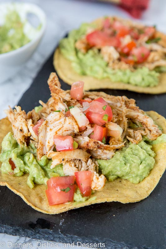 chicken tostada with guacamole on a plate
