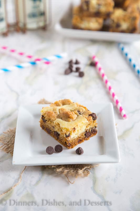 Chocolate Chip Cheesecake Bars - chocolate chip cookie bars with a layer of cheesecake in the center. So yummy!