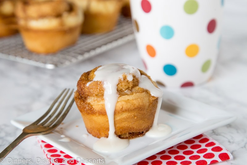 cinnamon roll muffin  on a plate with vanilla glaze