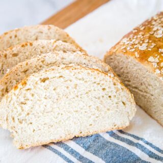 Honey Oat Bread - a soft and tender bread with oats and sweet honey.  This is an easy no-knead bread that is great for toast, sandwiches, or even with soup for dinner. 