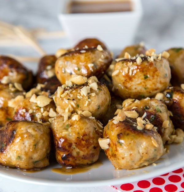A plate of meatballs with peanuts