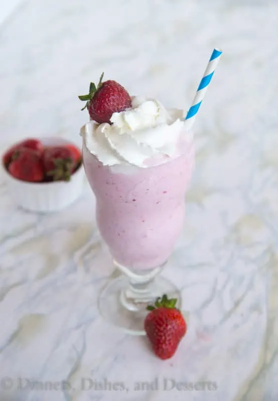 Strawberry Milkshake - An old fashioned milkshake made with fresh strawberries and vanilla ice cream. A delicious and refreshing treat this summer!