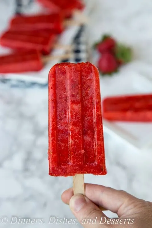 stawberry popsicles on a plate