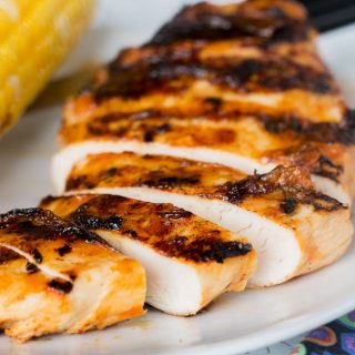Grilled Chicken with Peach Barbecue Sauce - juicy grilled chicken with a sweet, smoky, and slightly spicy peach barbecue sauce.