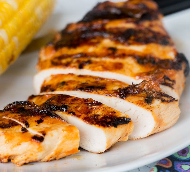 Grilled Chicken with Peach Barbecue Sauce - juicy grilled chicken with a sweet, smoky, and slightly spicy peach barbecue sauce.