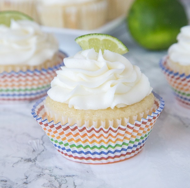 Margarita Cupcakes - Lime flavored cupcakes that are spiked with tequila! Plus a boozy lime frosting to top it off. Great for taco night, Cinco de Mayo or just because. Non-alcoholic recipe included!