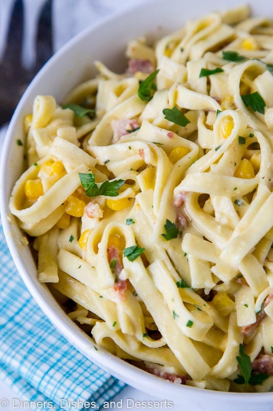 bowl of pasta carbonara with corn and chilies