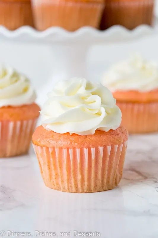 strawberry almond cupcakes topped with frosting
