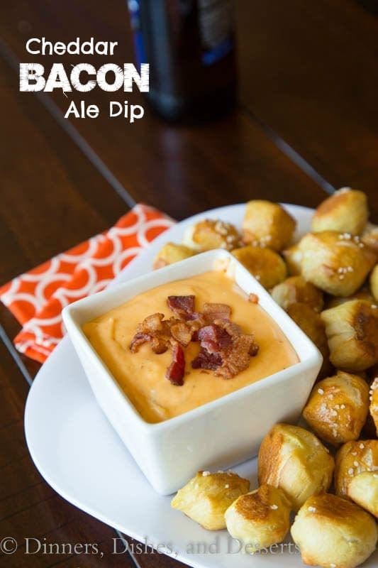 beer cheese dip in a bowl with pretzel bites