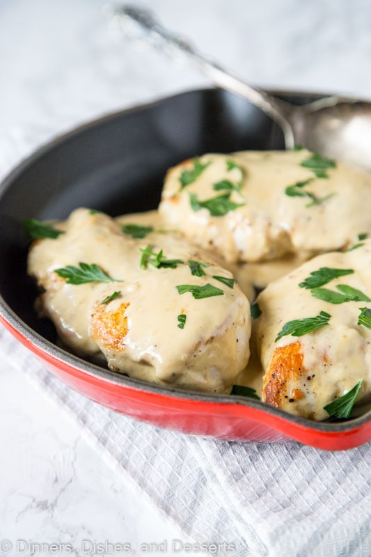 A bowl of food, with Chicken and Sauce