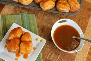 Pumpkin Caramel Monkey Bread Muffins with bowl of caramel