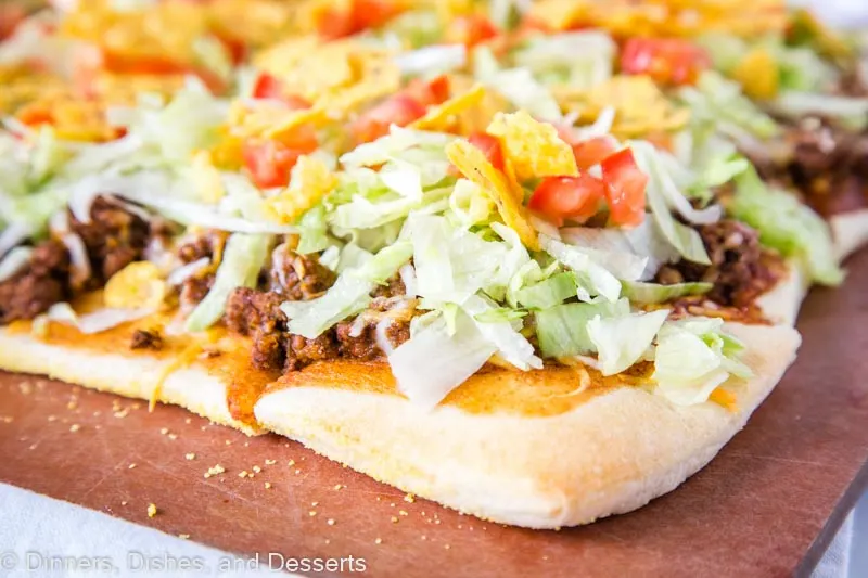 Taco Pizza - A super easy pizza recipe with all the flavors of taco night!  A fun dinner the entire family will love! 