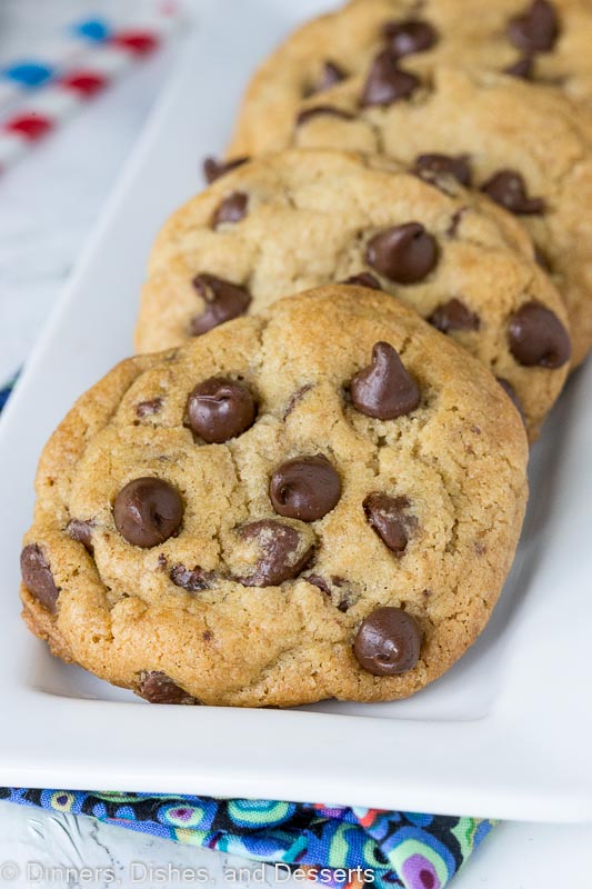 thick and chewy chocolate chip cookies lined on a plate