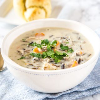 A bowl of soup, with Cream and wild rice