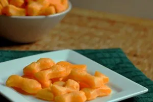 Homemade Goldfish Crackers on white plate with green napkin