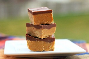 Peanut Butter Bars stacked on white plate