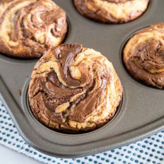 Nutella Muffins - Soft and tender homemade muffins with a delicious swirl of Nutella.