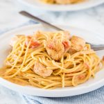 Creamy Cajun Chicken Pasta - Get dinner on the table fast with this creamy pasta full of spicy creole seasoning, tomatoes, and chicken!  