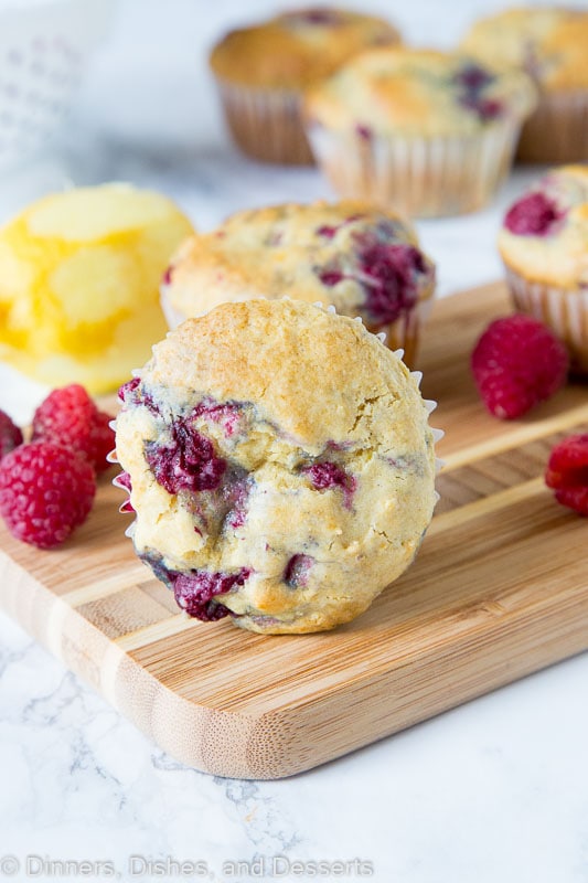 a raspberry muffin on a wooden board