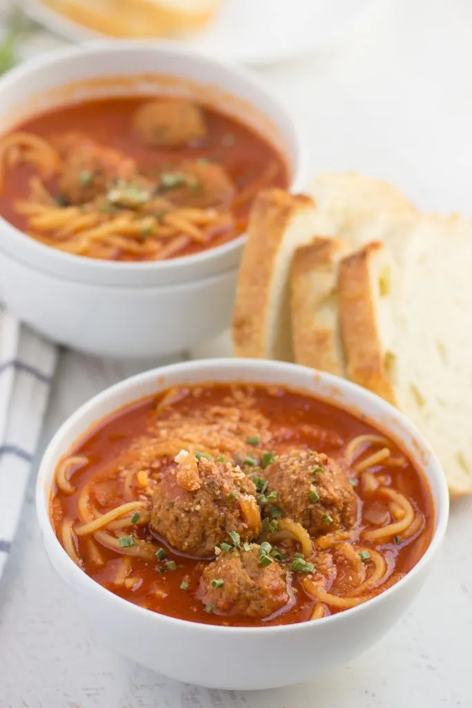 spaghetti and meatball soup in a bowl