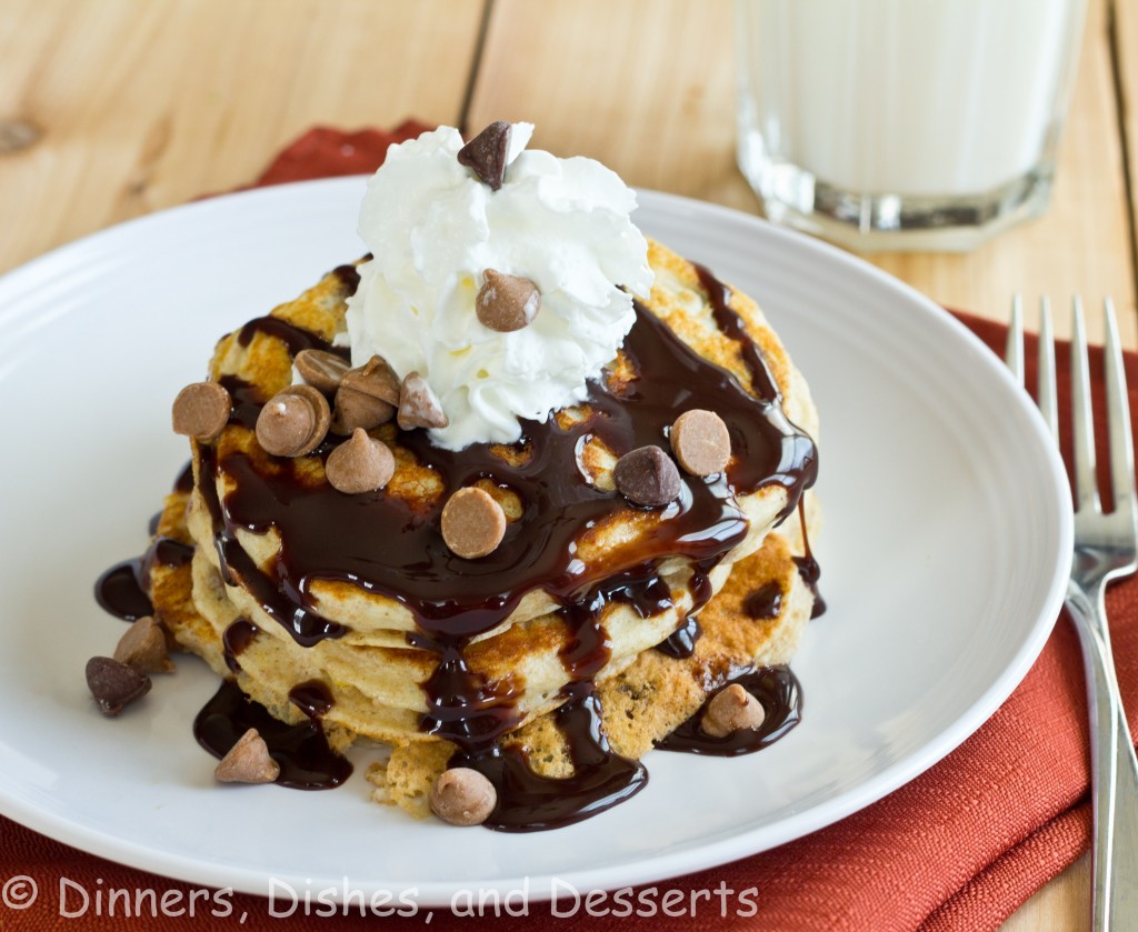 Peanut Butter Chocolate Chip Pancakes - Light and fluffy buttermilk pancakes topped with peanut butter, chocolate sauce, and whipped cream! It is like dessert for breakfast!