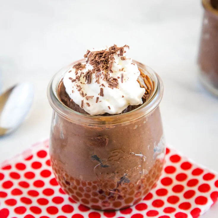chocolate mousse in a jar with whipped cream