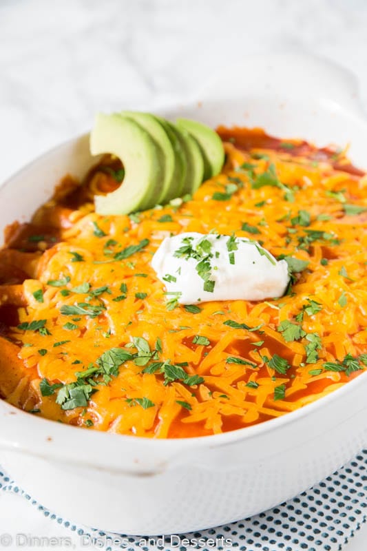 A plate of food, with Enchilada and Cream