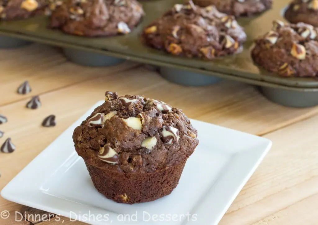 chocolate banana white chocolate chip muffins on a plate