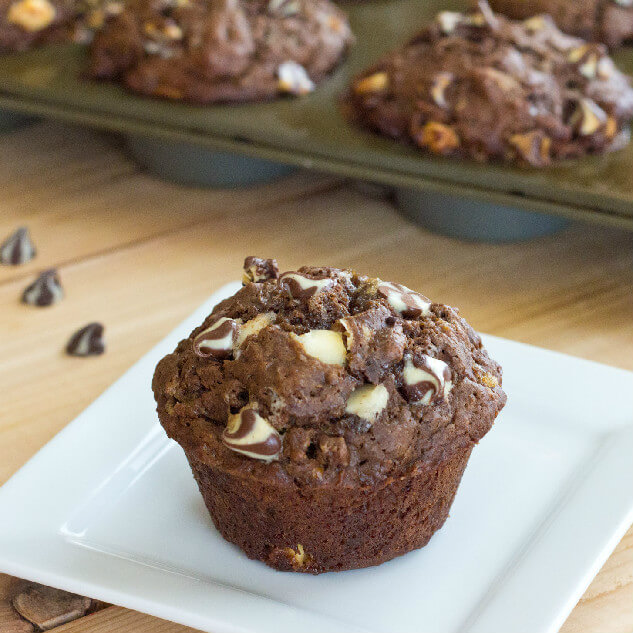 Chocolate Banana White Chocolate Chip Muffins - Moist and tender chocolate and banana muffins with lots of white chocolate chips.