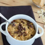 close up cookie dough baked oatmeal in a white bowl