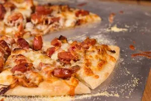 Caramleized Onion and Andouille Pizza on baking sheet