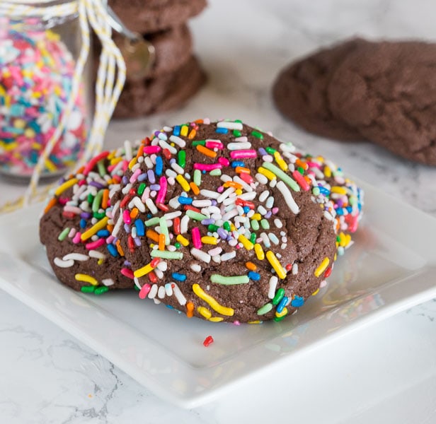 Chocolate Sprinkle Cookies - chocolate cookies from cake mix are super easy to make! Just 3 ingredients to make these thick, chewy, and fudgy cookies.  Coated in fun sprinkles for any occasion.