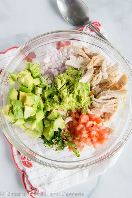 Avocado Chicken Salad with no mayo or sour cream. All the ingredients in a bowl ready to mix