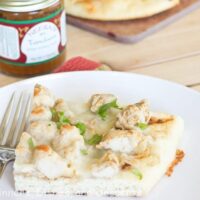 tandoori chicken naan pizza on a plate
