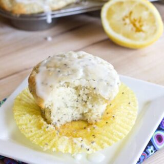 Lemon Chia Seed Muffins - Super moist and light lemon muffins with chia seeds. Made with Greek yogurt. Complete with a light glaze!