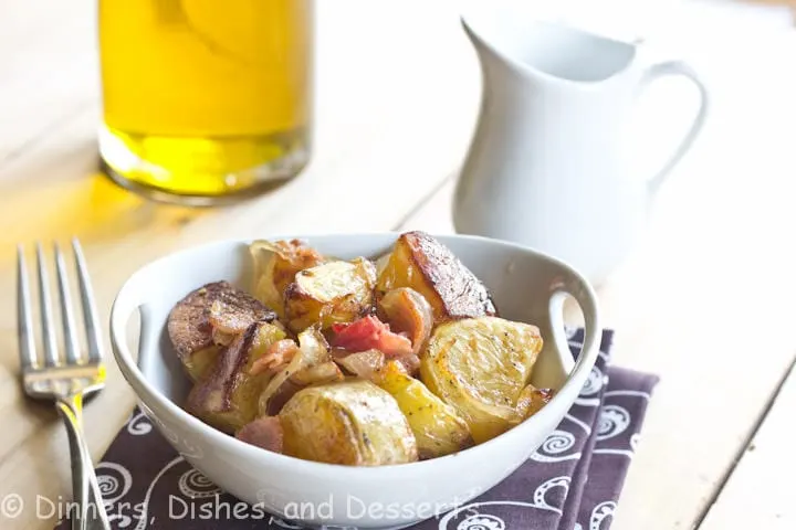 roasted potato salad with caramelized onions and bacon in a bowl