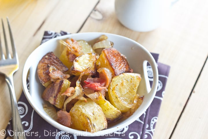 roasted potato salad with caramelized onions and bacon in a bowl