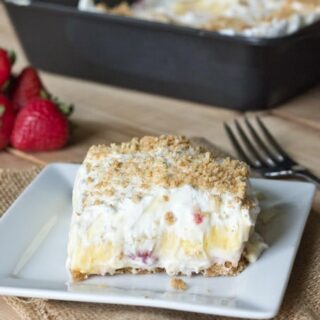 Strawberry Cream Squares - light and creamy layers with fresh strawberries and a graham cracker crust. Easy and delicious no bake dessert! 