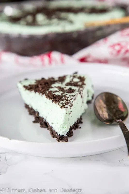mint pie on a plate with a spoon