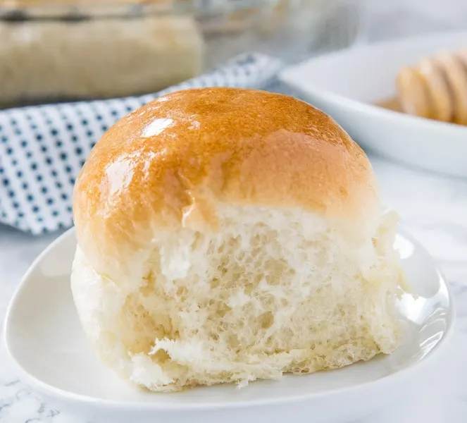 A dinner roll on a plate