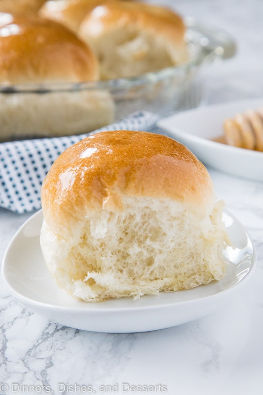 dinner roll on a plate with honey