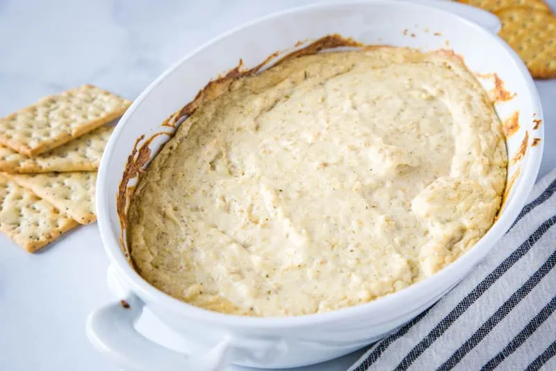 Hot Artichoke Dip Recipe - this baked artichoke dip is creamy, cheesy, and the perfect appetizer for any get together.  Easy to make ahead and always disappears quickly!